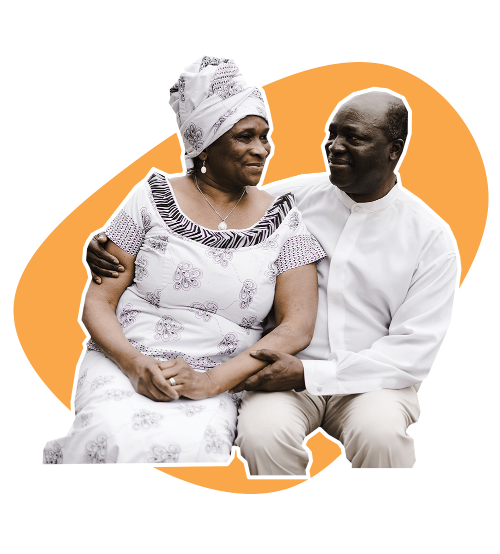 Elderly Ghanaian Man Holds His Wife Lovingly As They Sit