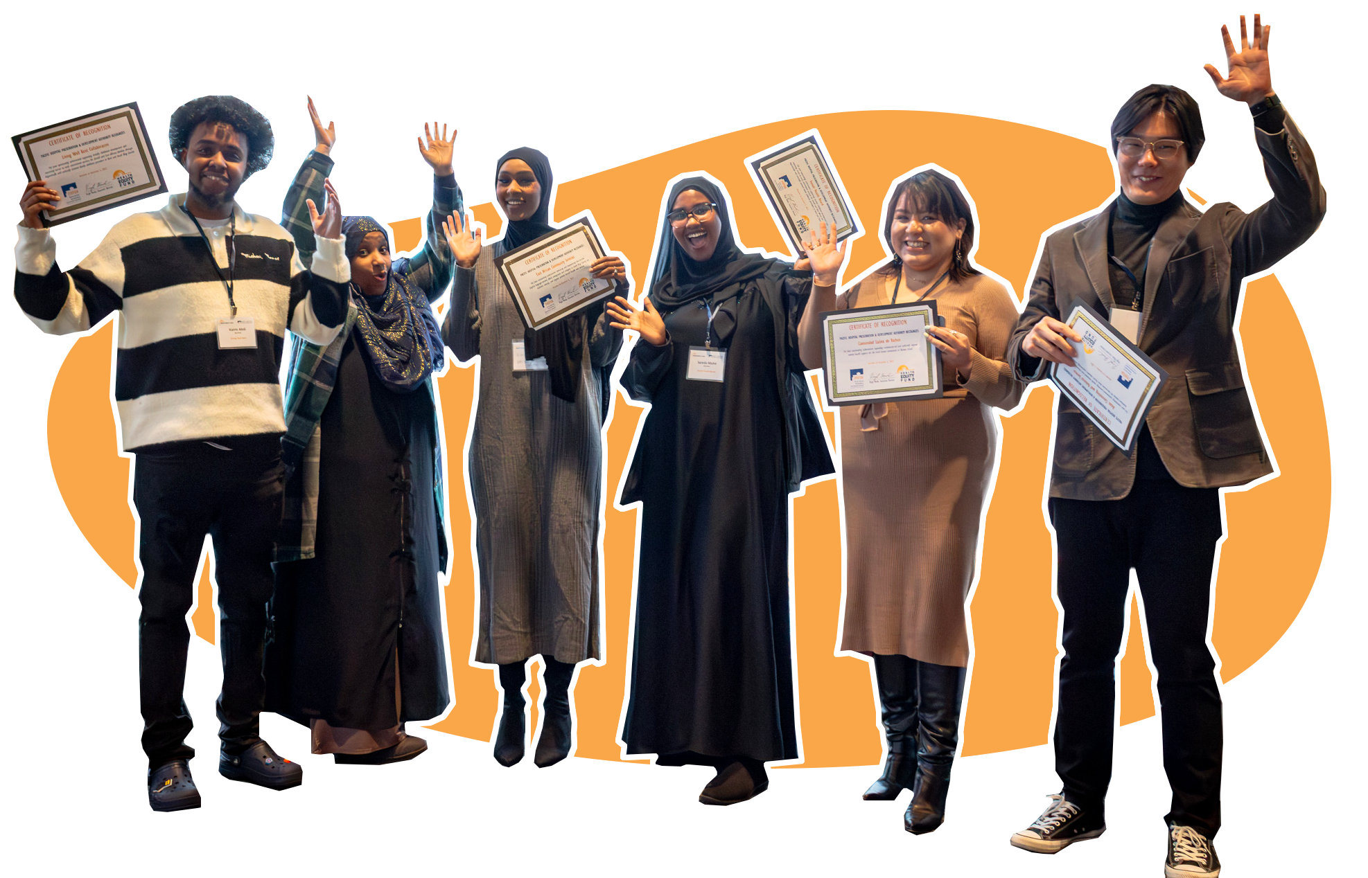 Six people smiling and standing with their hands and certificate of recognitions up